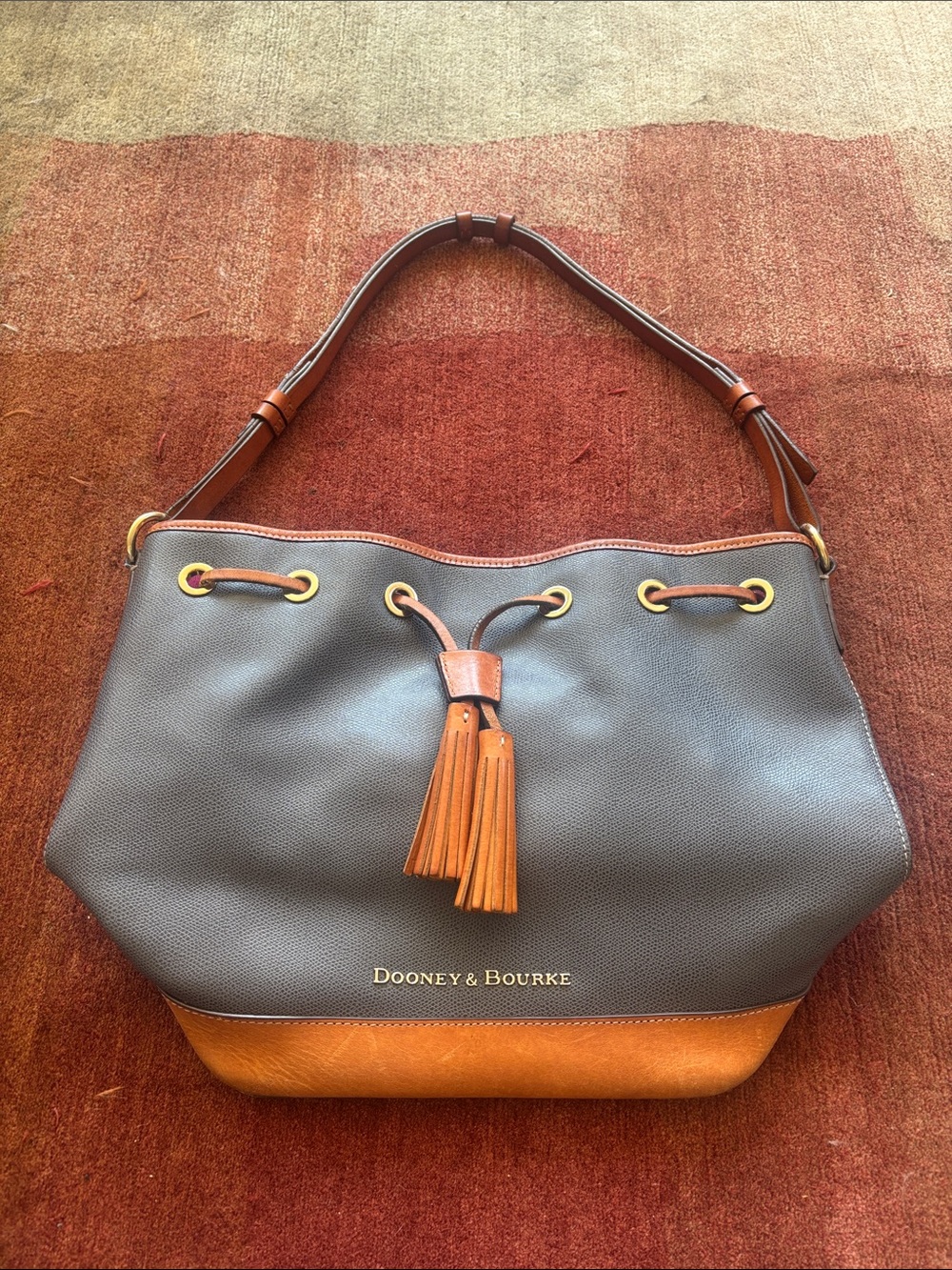 Dooney & Bourke Slate Blue and Brown Leather Tassel Bucket Bag